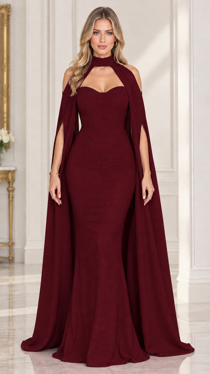 Front view of woman wearing burgundy wine red cape sleeve mermaid gown
