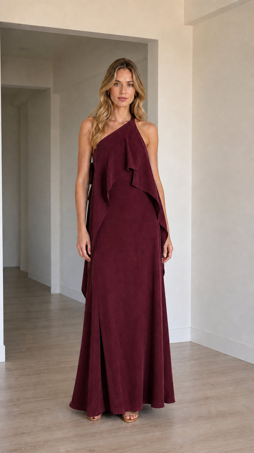 Front view of model wearing the one-shoulder cascading ruffle maxi dress in rich burgundy