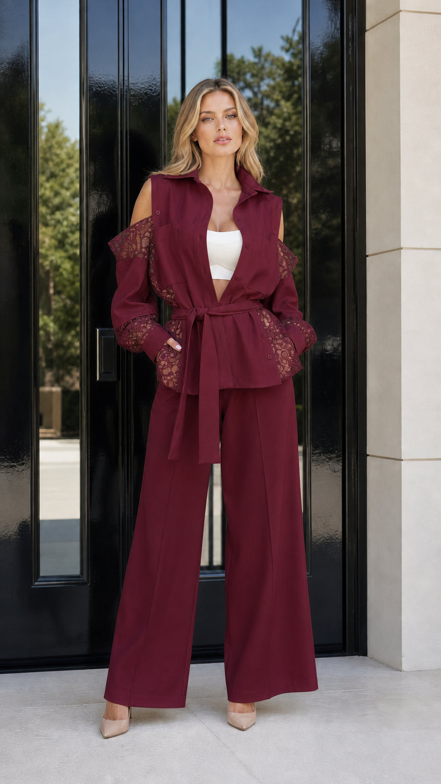 Model wearing burgundy wine red cold shoulder lace blazer and wide leg pants set