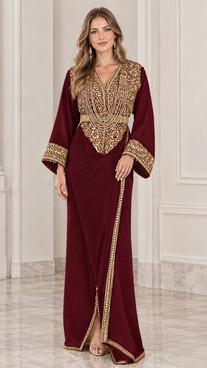 Front view of model wearing burgundy red kaftan maxi dress with gold embroidery