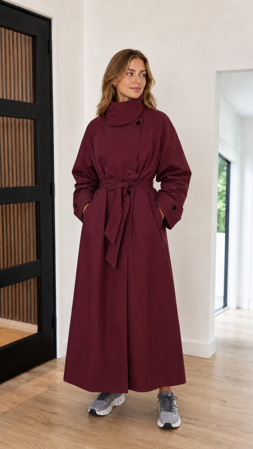 Front full-length view of burgundy high neck maxi trench coat