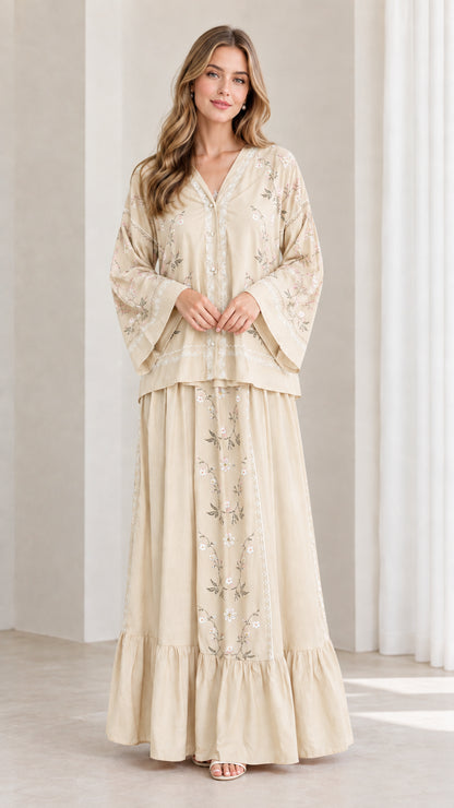 Model wearing beige cream floral embroidered two-piece maxi skirt set