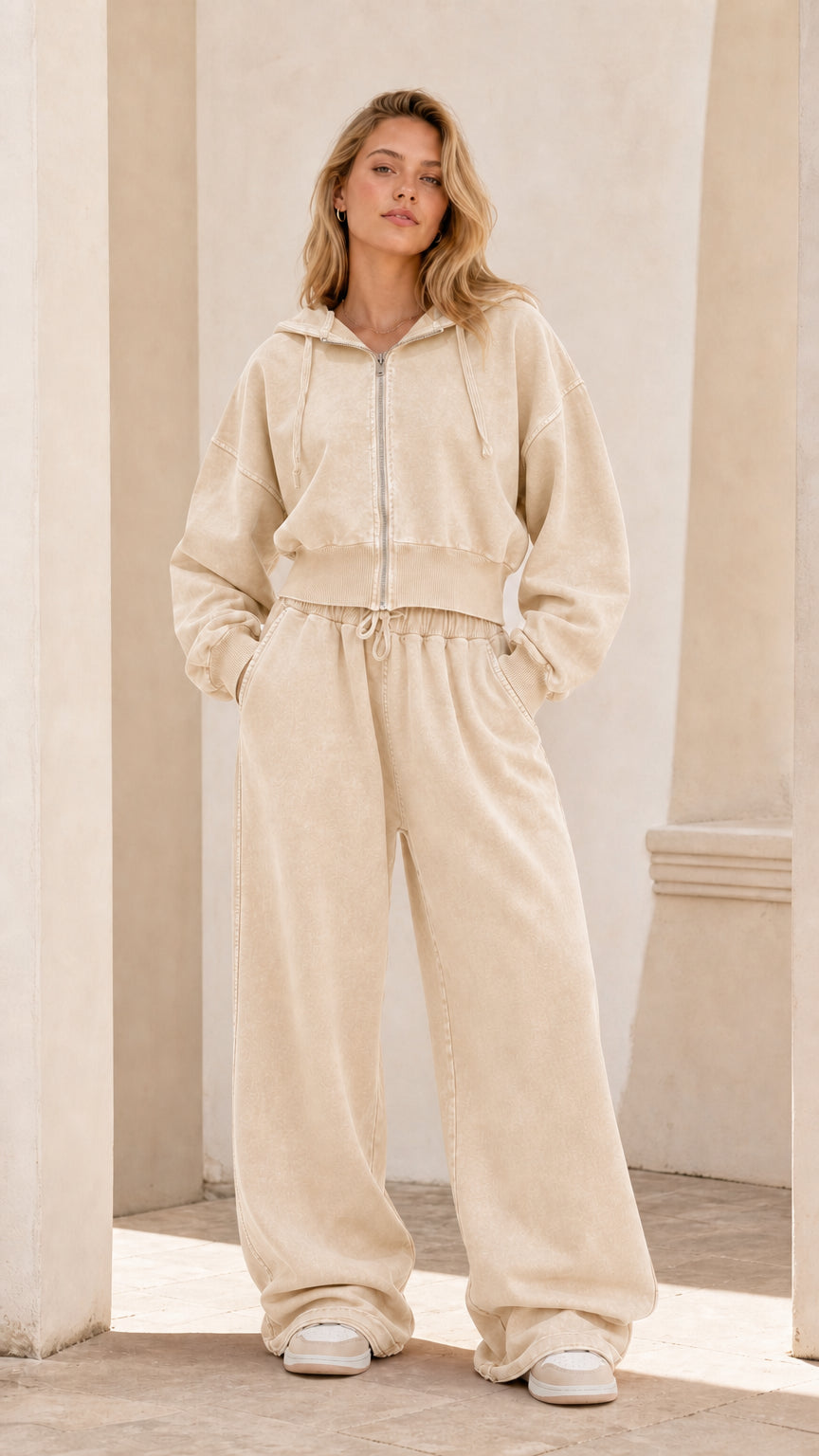 Full front view of model wearing sand beige cropped zip hoodie and wide leg sweatpants set