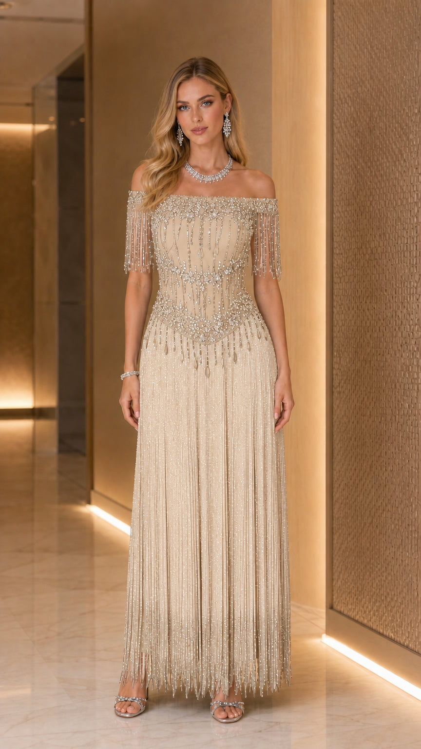 Model wearing Champagne gold off-the-shoulder beaded fringe evening gown