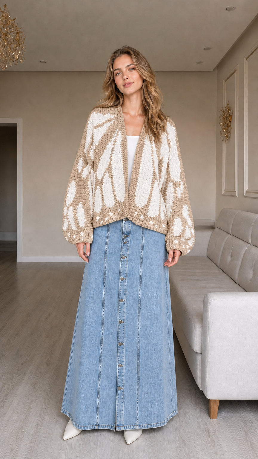 Model wearing beige and cream butterfly chunky knit open sweater