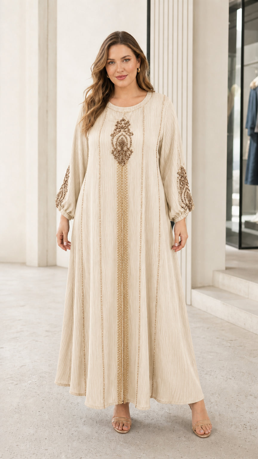 Woman wearing beige cream long sleeve beaded embroidery kaftan dress