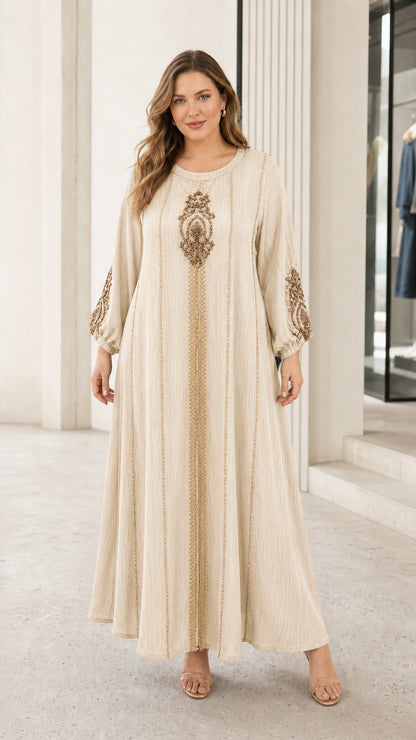 Woman wearing beige cream long sleeve beaded embroidery kaftan dress