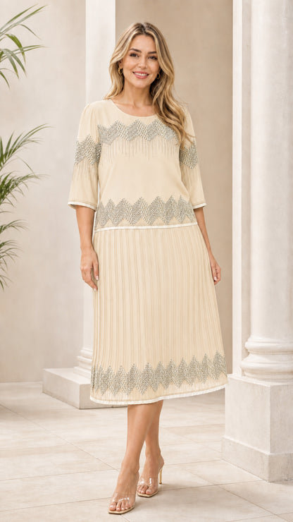 Ivory geometric pleated midi dress shown from the front