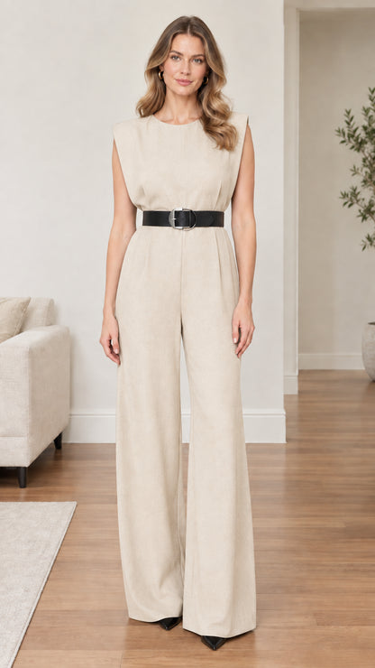 Model wearing beige cream sleeveless wide-leg jumpsuit with black belt