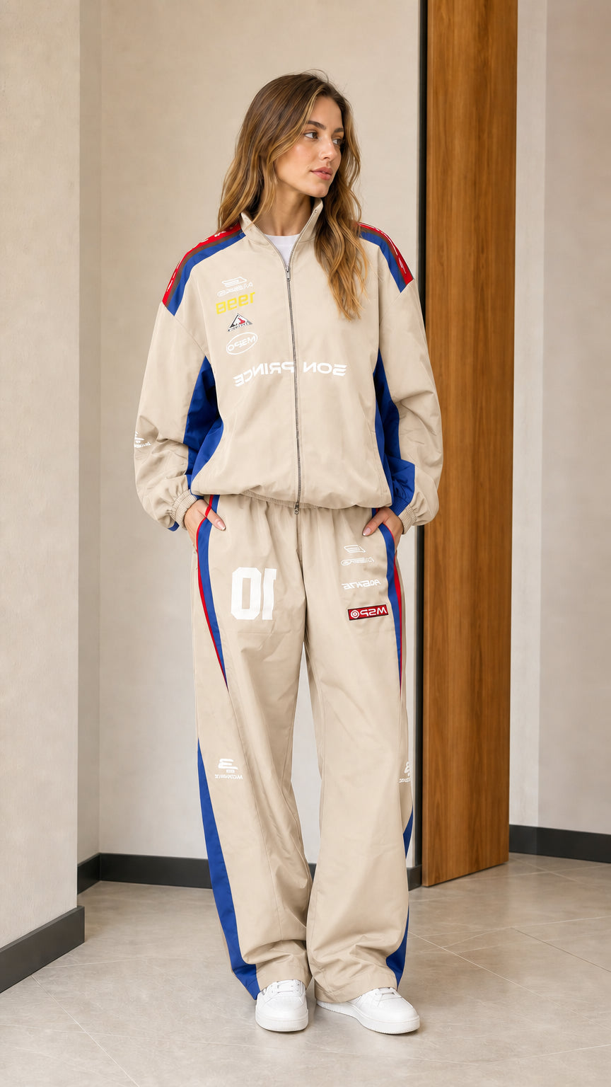 Front view of woman wearing beige colorblock racing two-piece tracksuit set