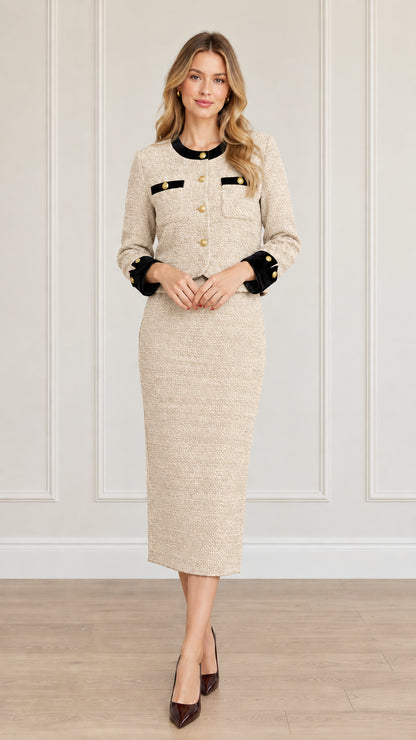Full-length front view of women's beige tweed skirt suit set with black contrast trim