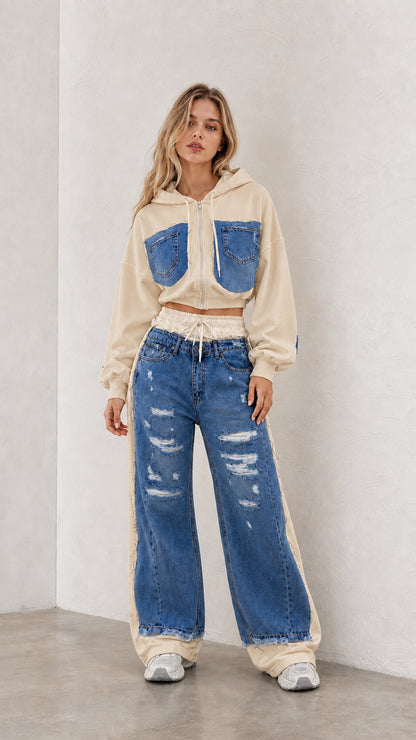 Model wearing beige cropped zip hoodie and blue denim spliced wide leg pants set