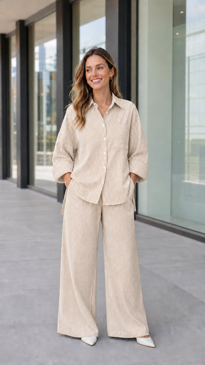Full-length view of woman wearing beige khaki striped two-piece shirt and pant set