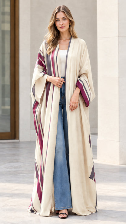 Full-length front view of woman wearing beige striped open front maxi kimono duster