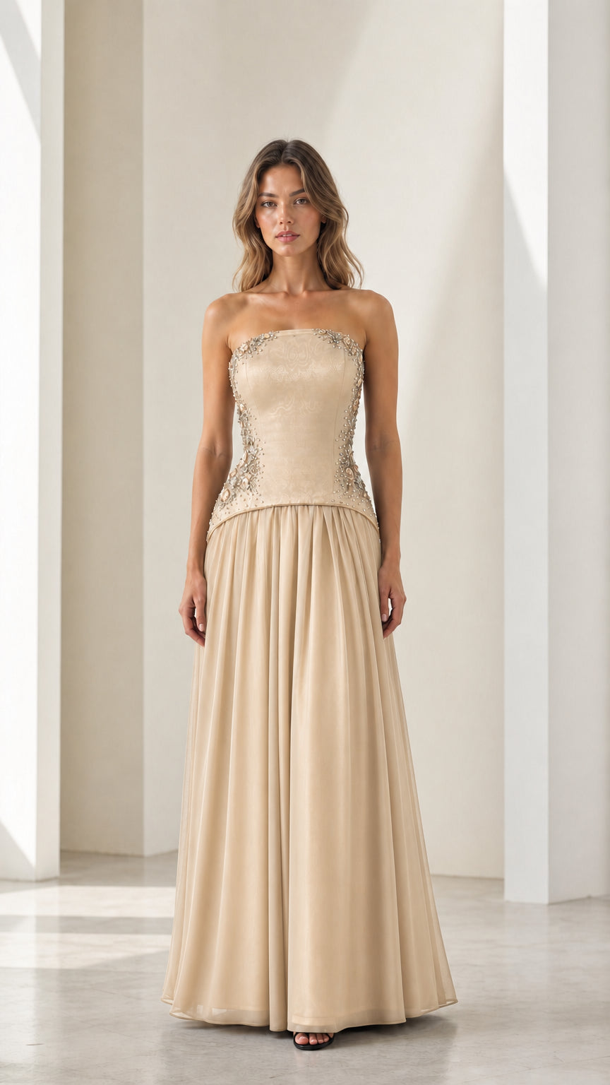Front full view of champagne gold strapless beaded basque waist gown